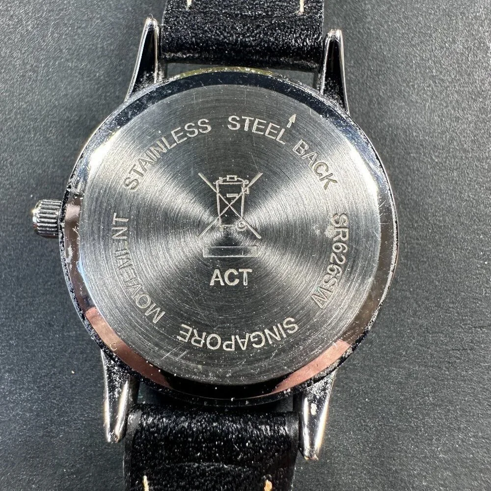 AVON SAFARI STRAP WATCH ZEBRA PRINT SHINY SILVERTONE STAINLESS STEEL, BLACK BAND